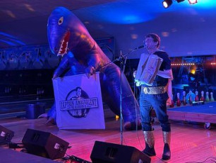 A stage across bowling lanes